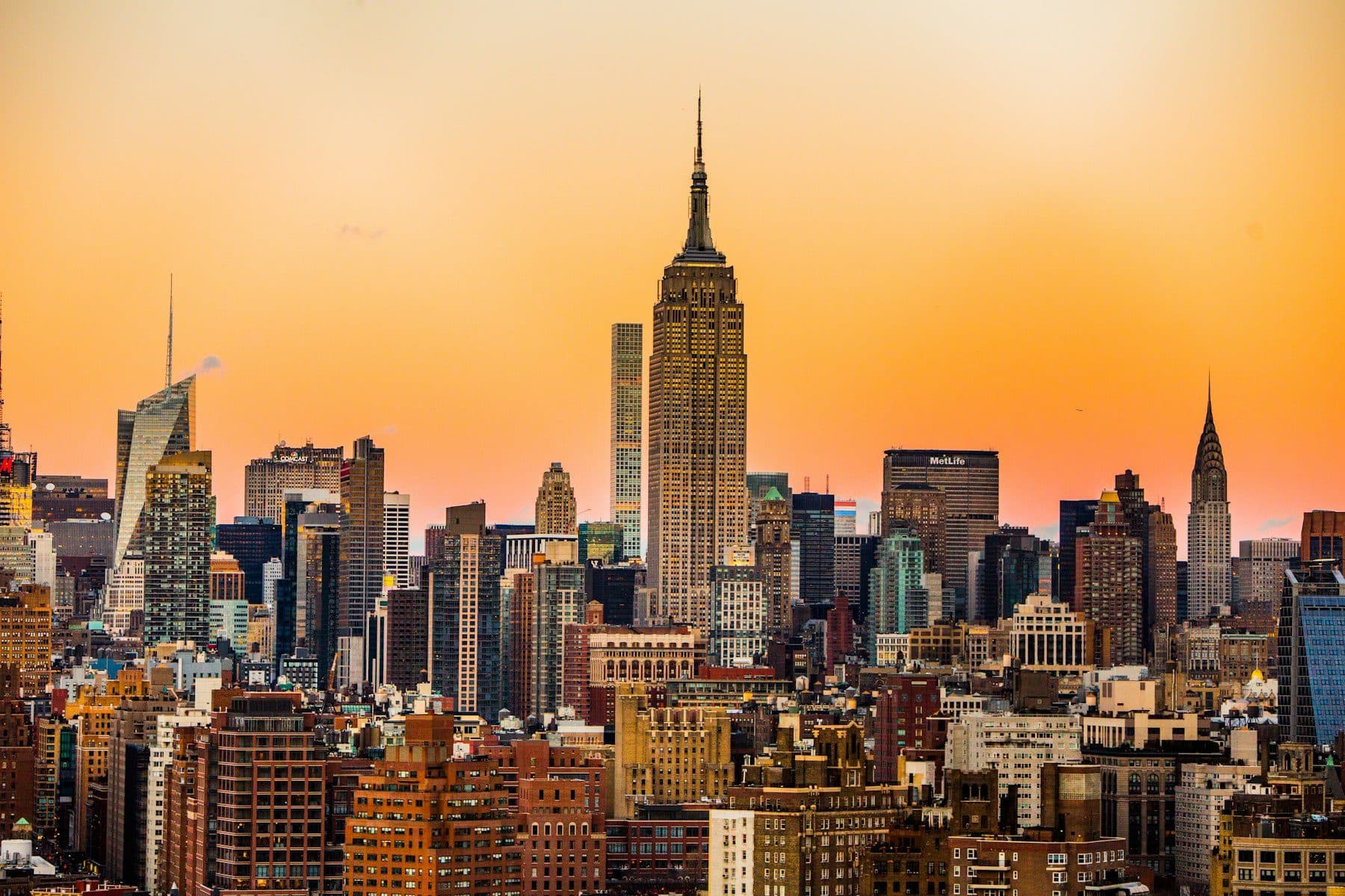 Manhattan skyline anchored by the Empire State Building at sunset
