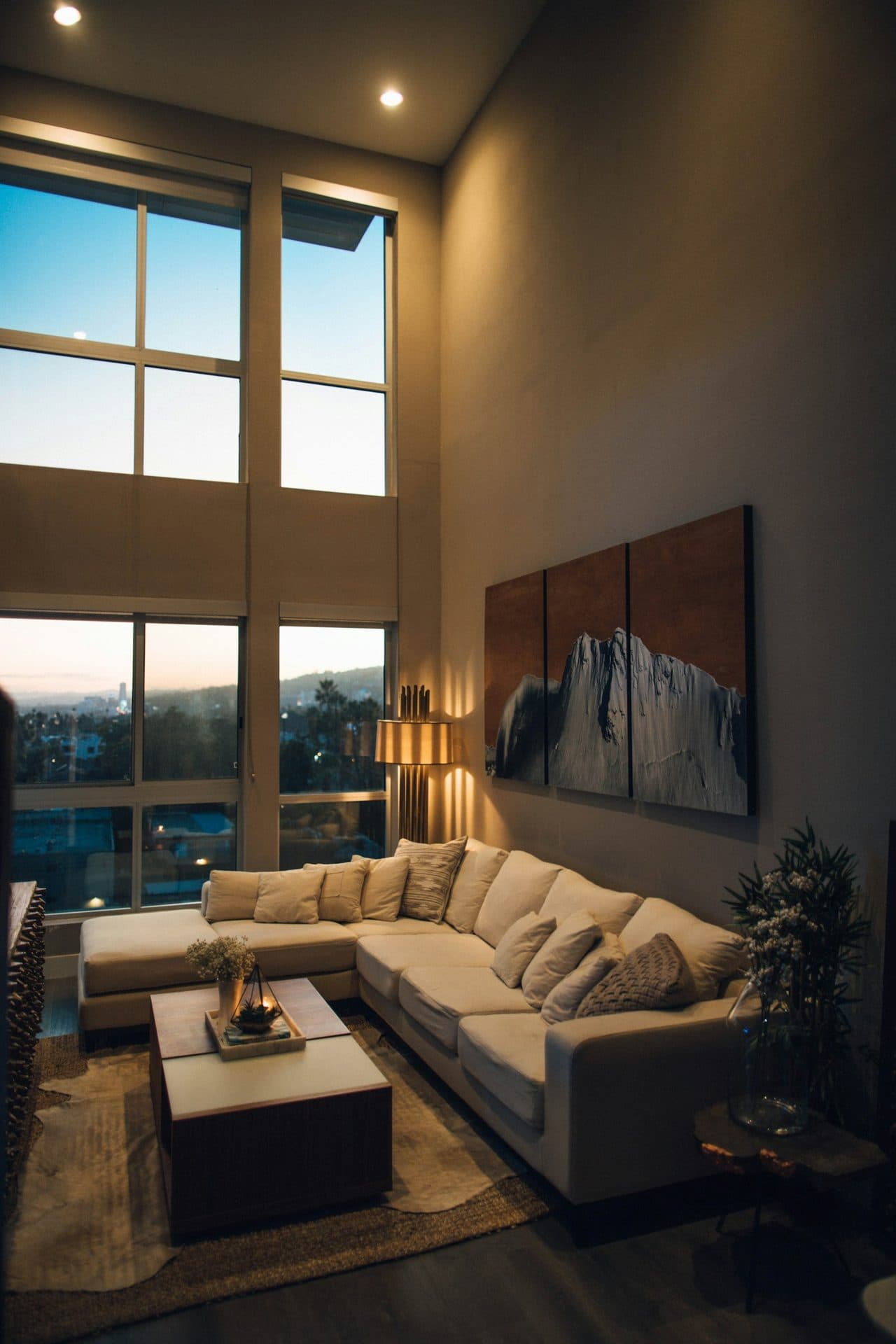 A chaise beside a sunlit living room window