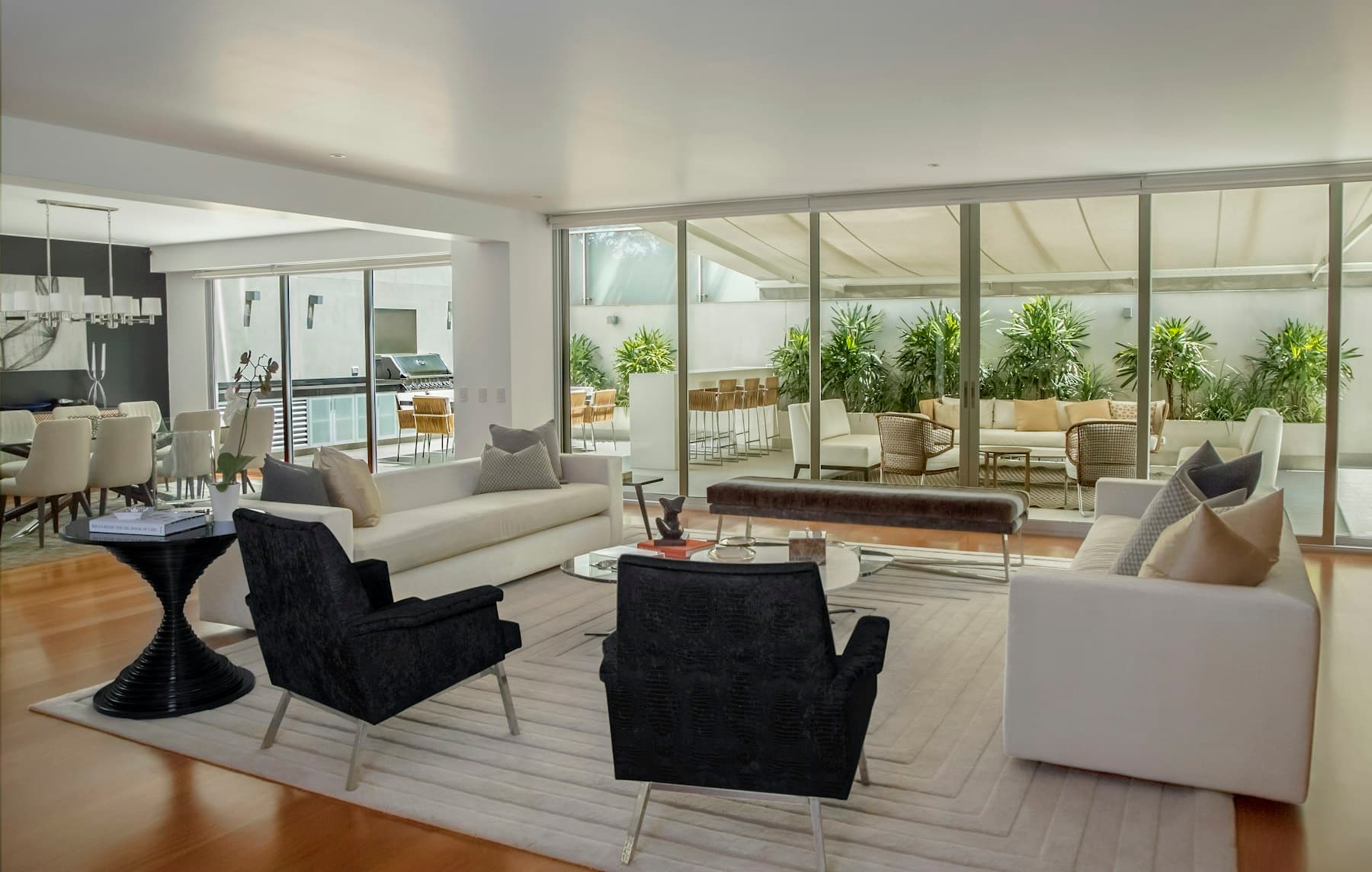 A luxury Manhattan penthouse living room with floor-to-ceiling glass