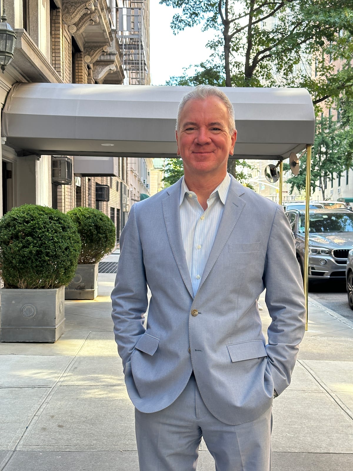 Michael J. Carroll on an Upper West Side street outside a pre-war building